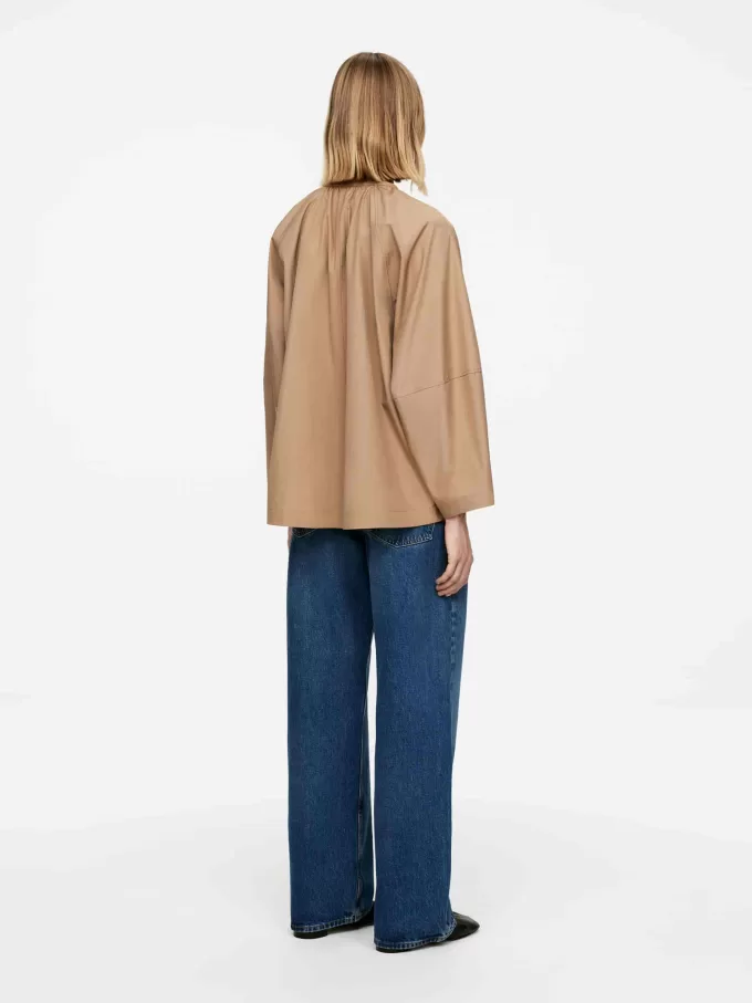 Blus framtill med knytband Blus framtill med knytband