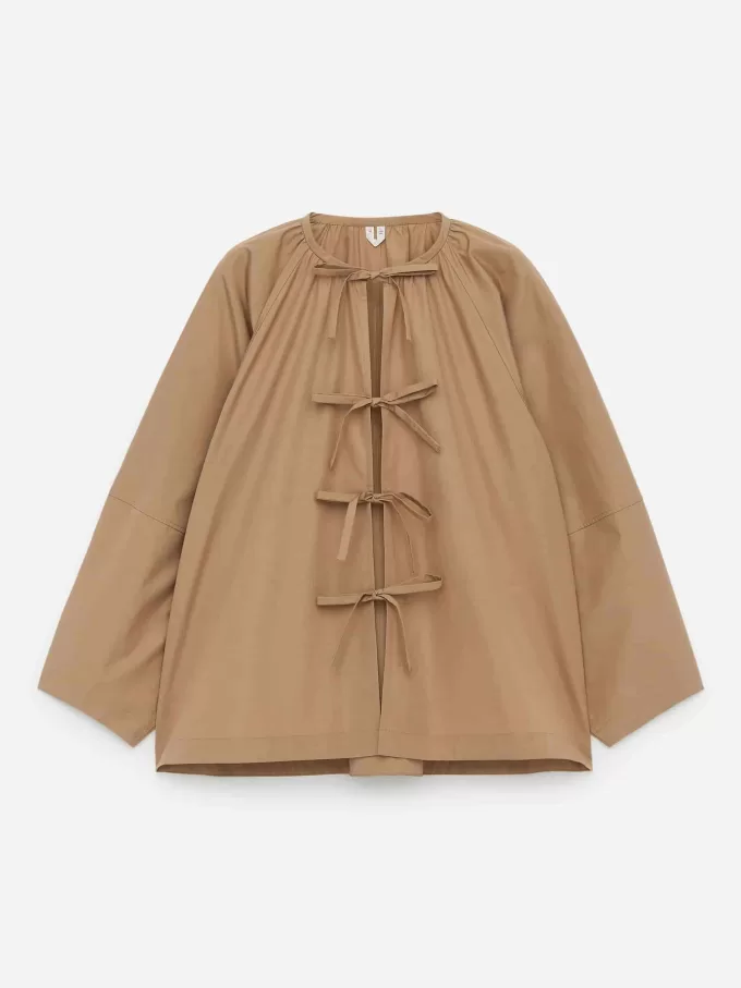 Blus framtill med knytband Blus framtill med knytband