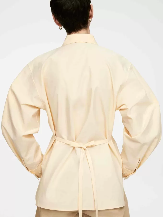 Blus i bomull med knytskärp Blus i bomull med knytskärp