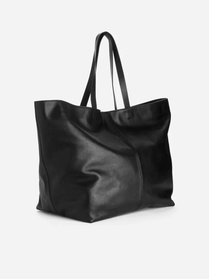 Tygväska i läder Tygväska i läder