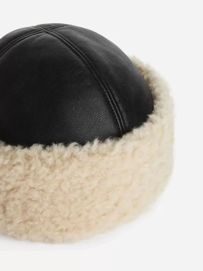 Värmande läderhatt Värmande läderhatt